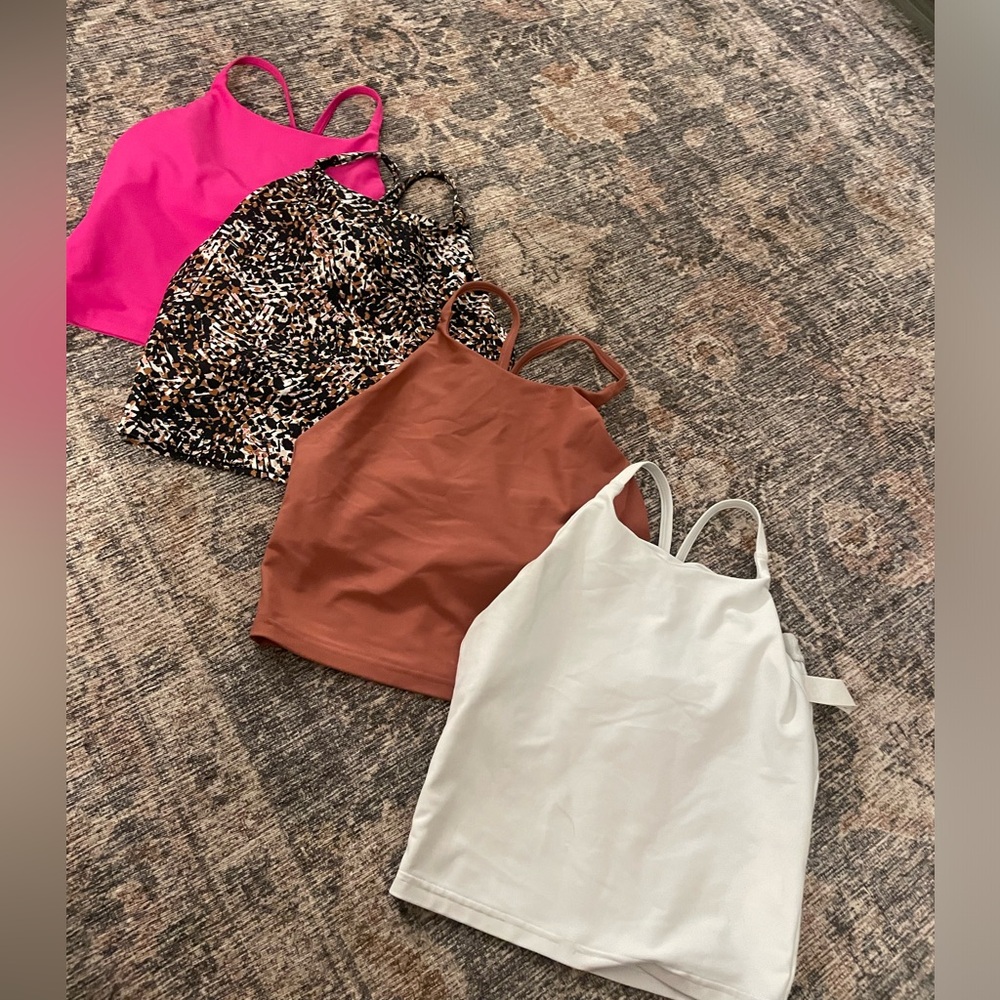Work out tanks with built in support, cross back